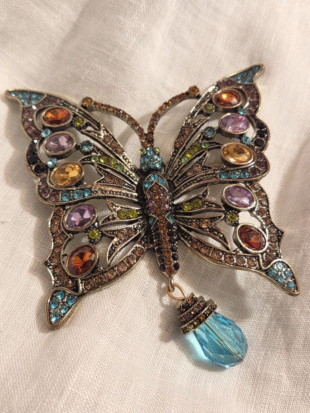 Multicolor Crystal Butterfly Brooch with Blue Teardrop Accent